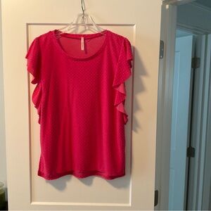 Pink dotted Swiss blouse with short sleeves.